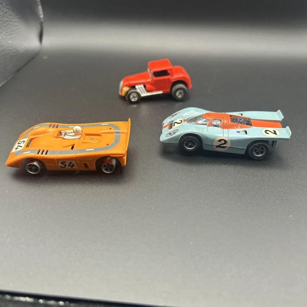 AURORA MCLAREN  AFX RARE TEAL BLUE #54  & YELLOW FERRARI CAN AM HO SLOT CAR #15